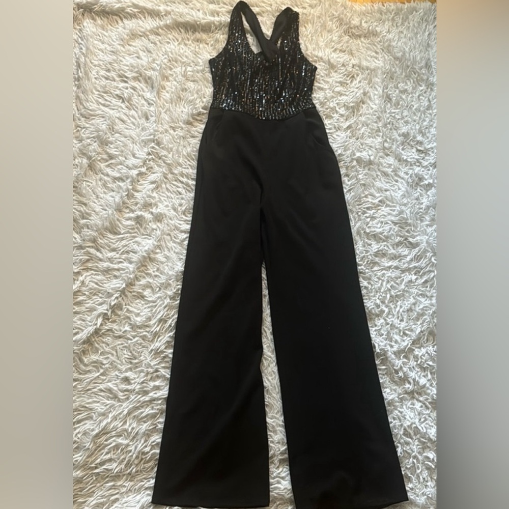 Pantsuit with black sequined top and open back.  Never worn